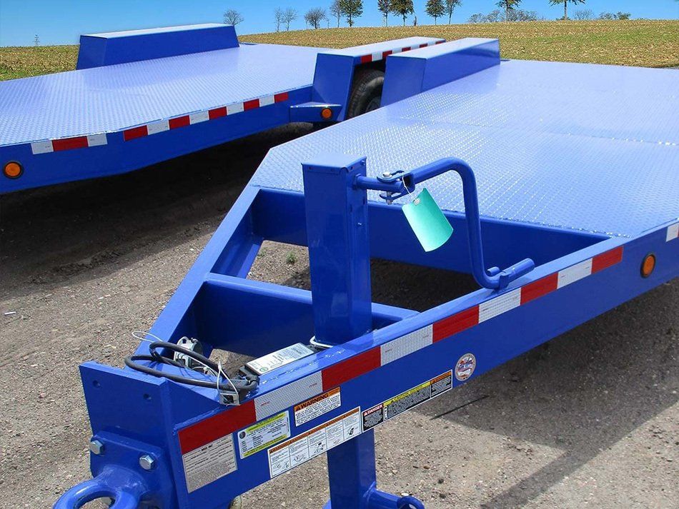 A blue trailer with a green tag on it