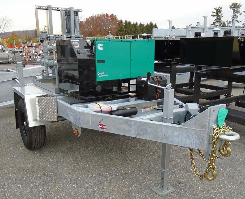 A trailer with a green box that says cummins on it