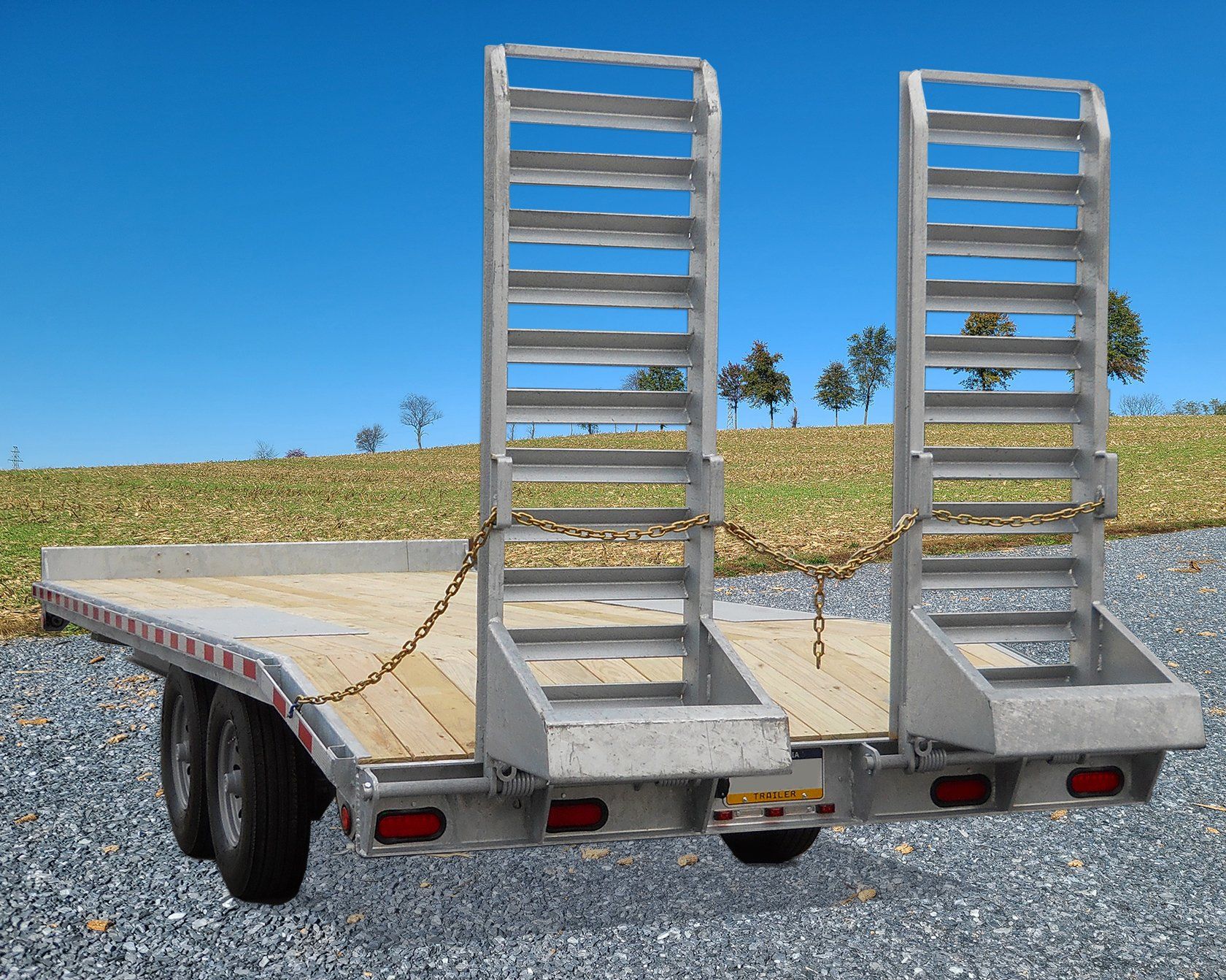 A trailer with a ladder attached to the back of it