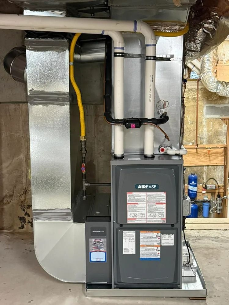 A heating and cooling system is installed in a basement.