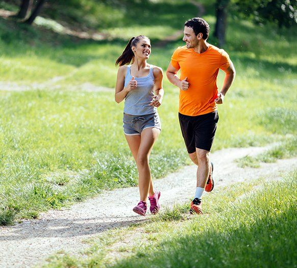 Couple Jogging in Nature — Millburn, NJ — Menon Regenerative Institute