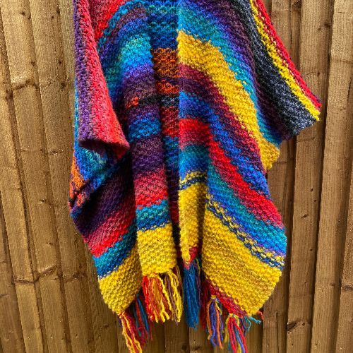 Knitted wrap in variegated yarn; wool and acrylic blend