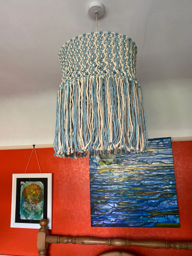 Lampshade in 4mm, blue and stone coloured cotton cord. The painting in the background is by Merridan Northover.