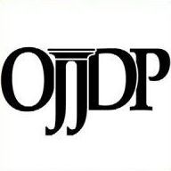 The logo for ojdp is a black and white logo with a gold frame.