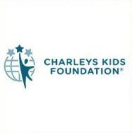 The charley 's kids foundation logo is a blue logo with a person holding a globe and stars.