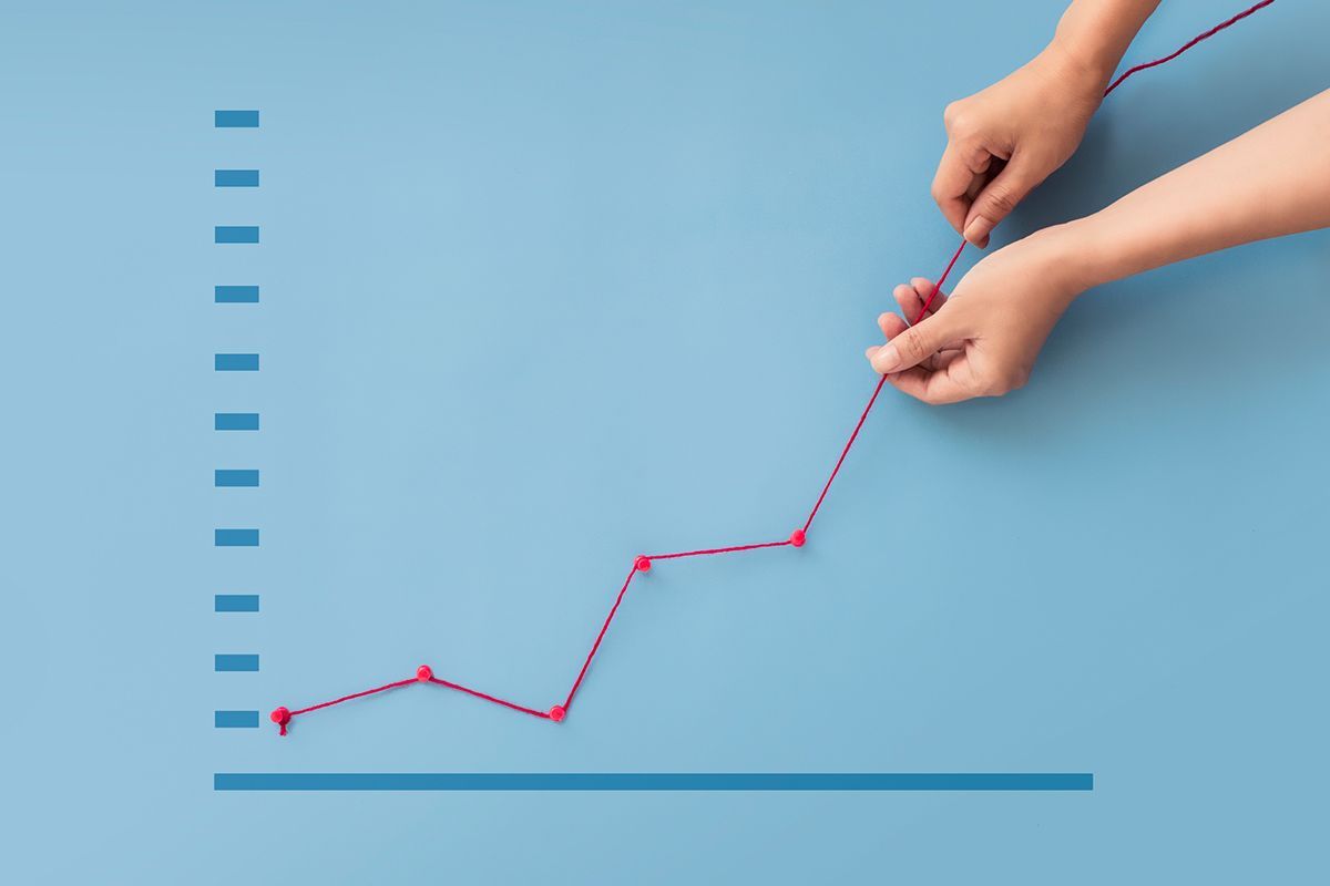 Hand Pulling Up Sales Report on Graph — Lake Charles, LA — Matherne Insurance & Financial Services