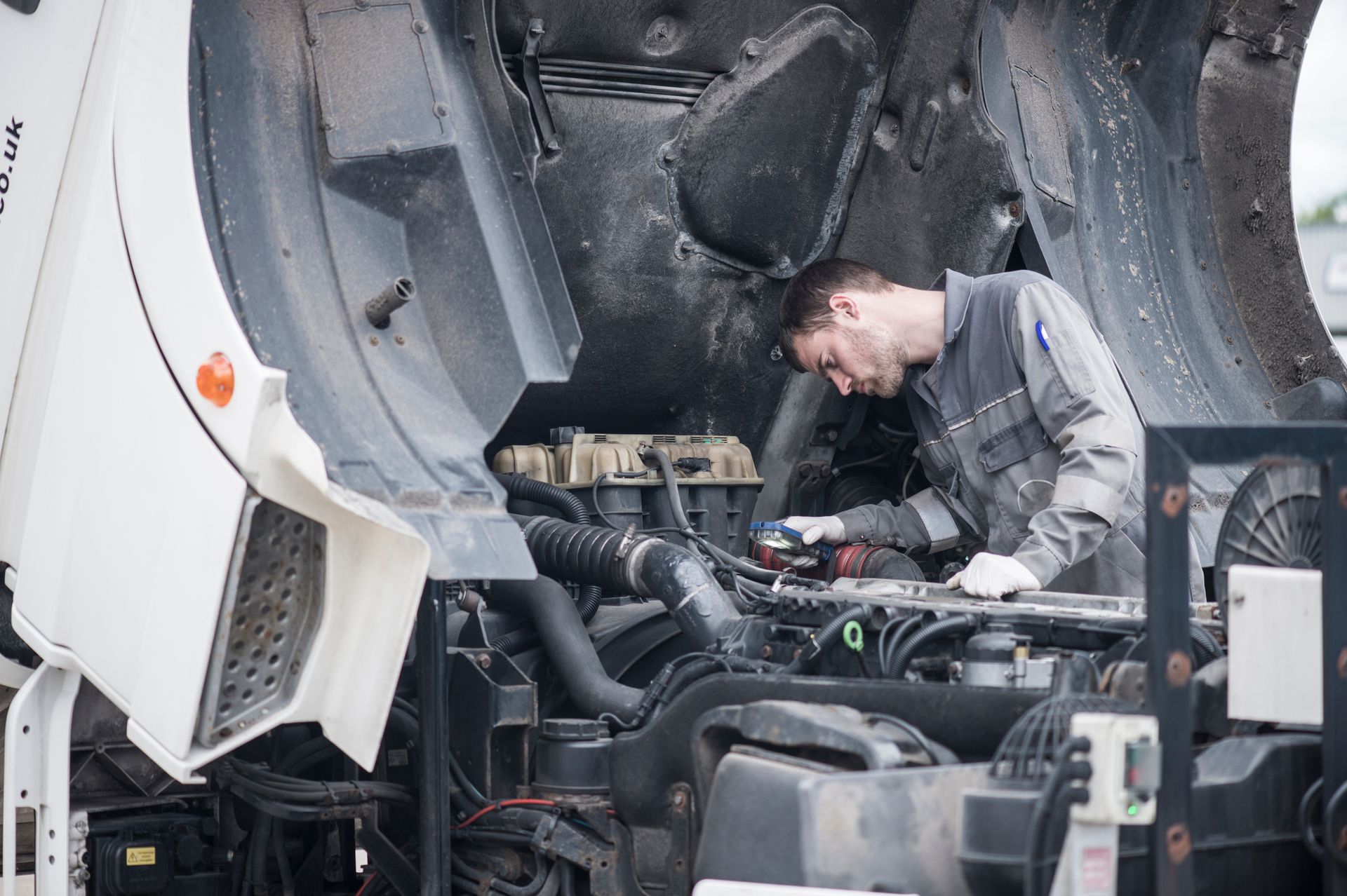 Mechanic working on truck. Mechanic working on truck.
