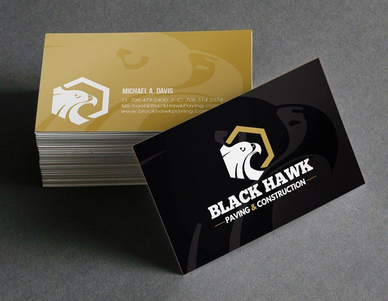 a business card for black hawk paving and construction