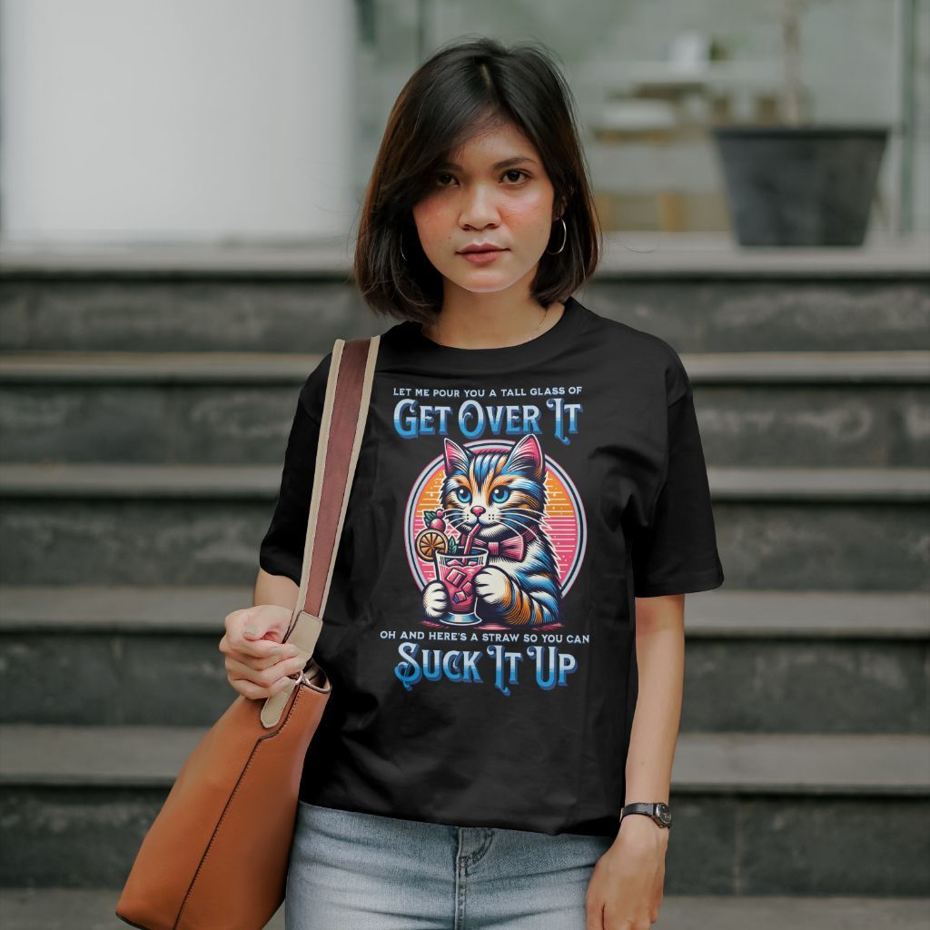 a woman is wearing a black t-shirt with a cat on it .