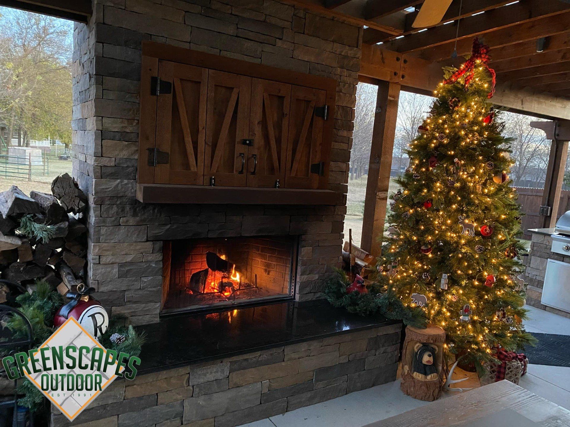 Fireplace next to Christmas tree