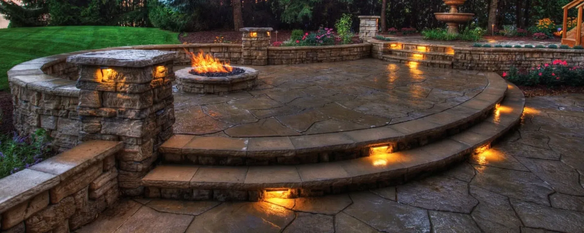 There is a fire pit in the middle of the patio.