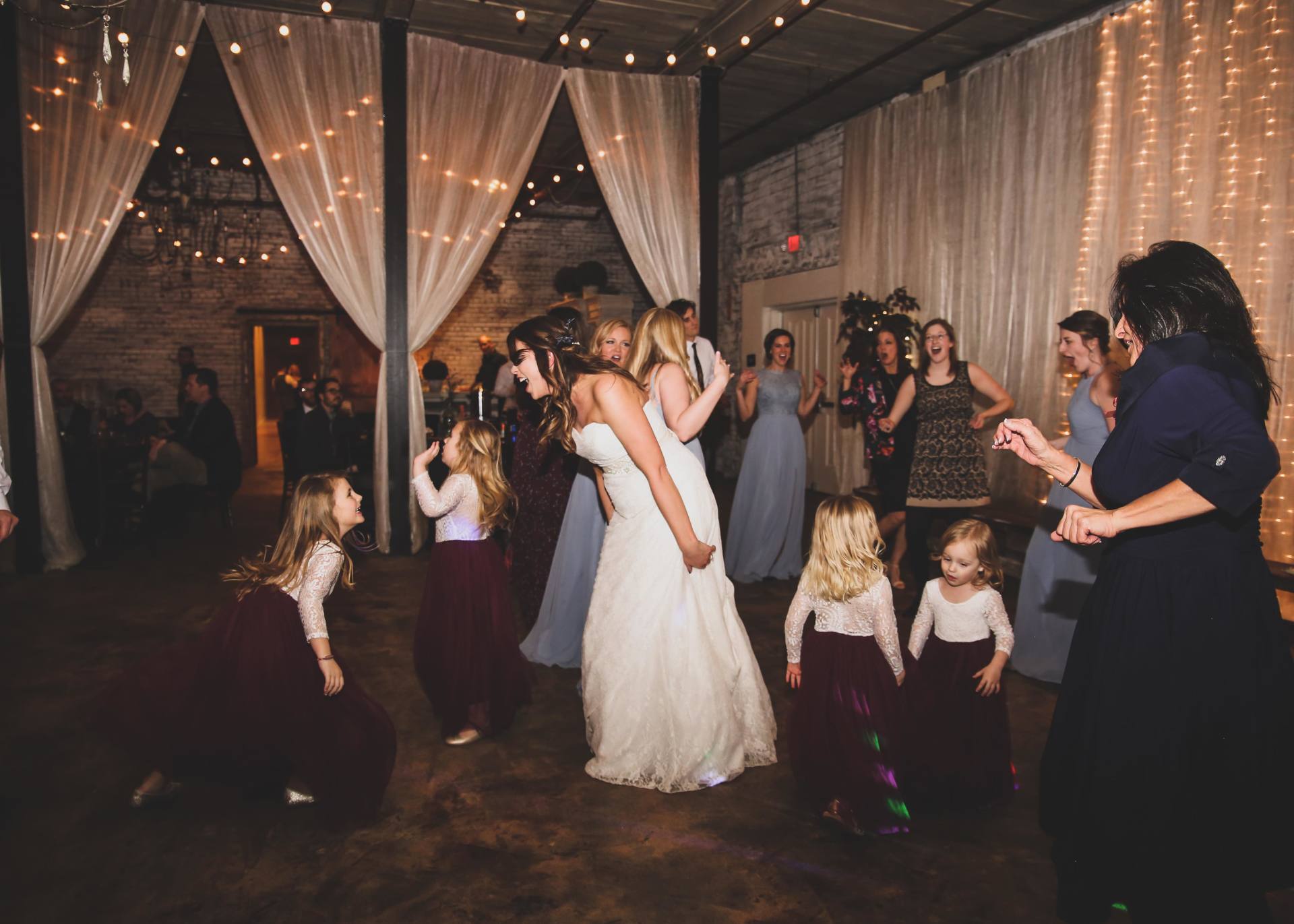 bride and the kids dancing