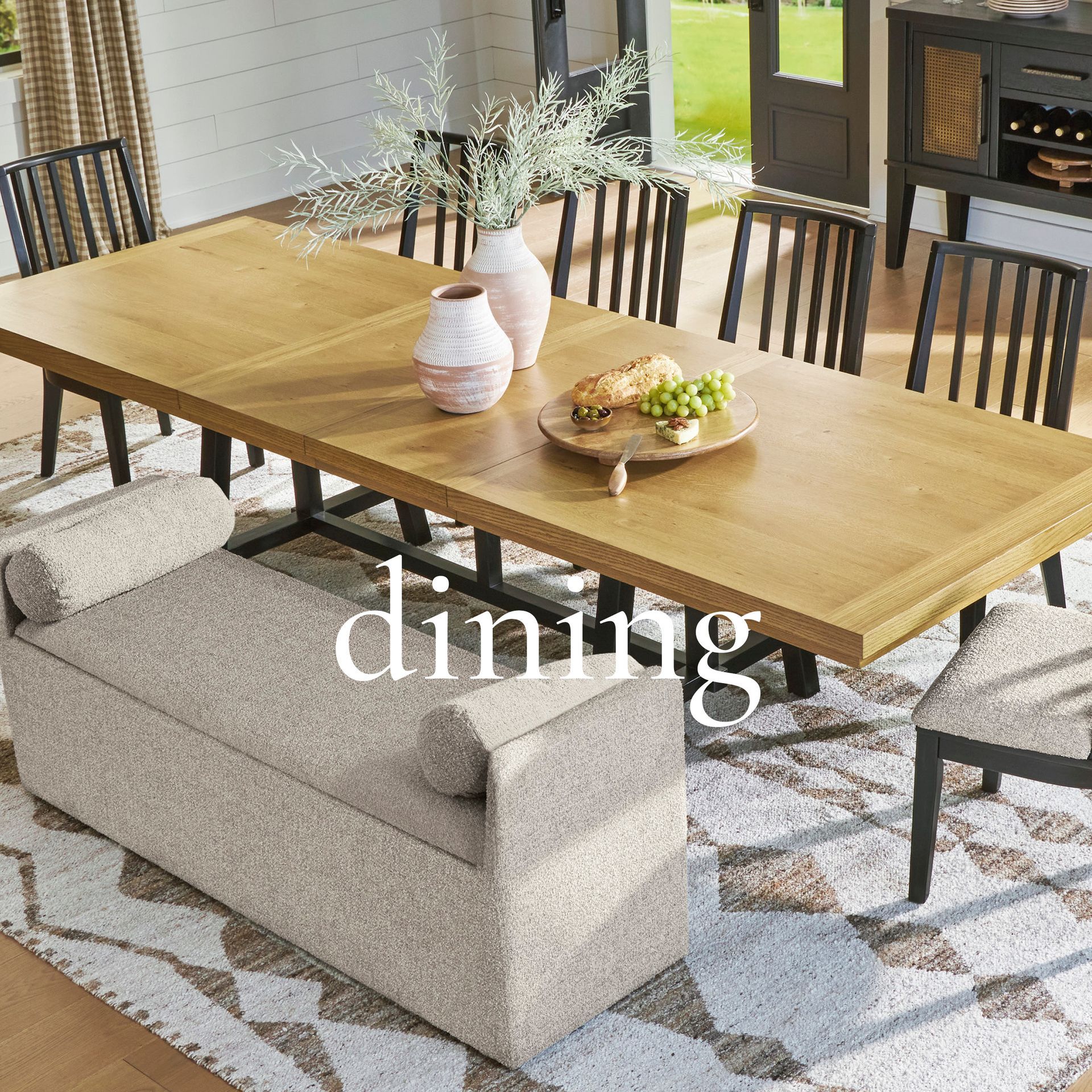 Dining room with a table, chairs, and a sideboard.