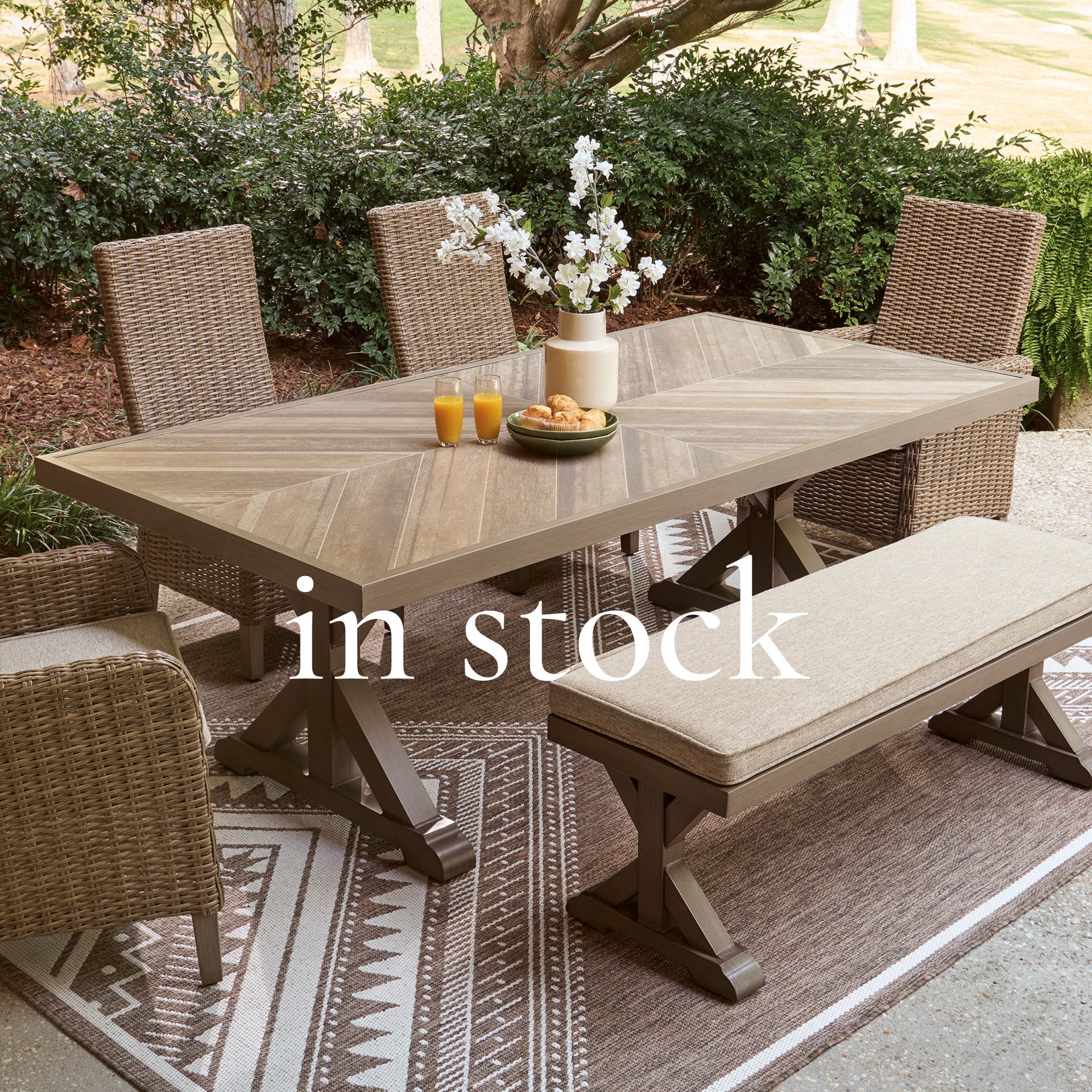 Cozy boucle armchair with pillow, side table, and artwork. 