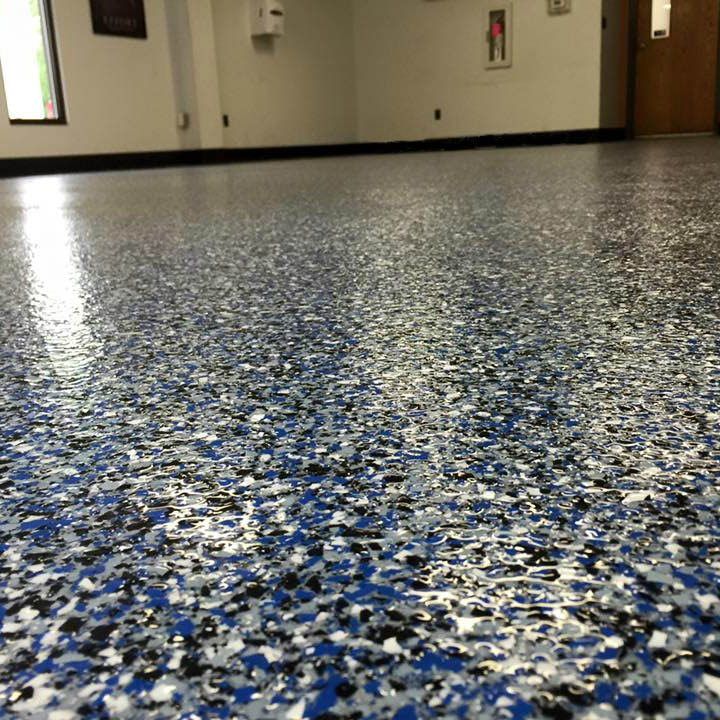 Newly installed epoxy garage floor with a glossy and seamless finish.