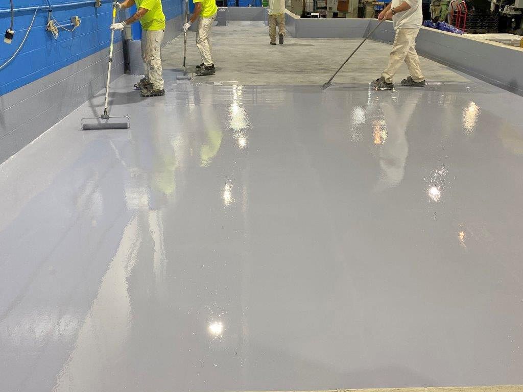 Newly installed epoxy garage floor with a glossy and seamless finish.