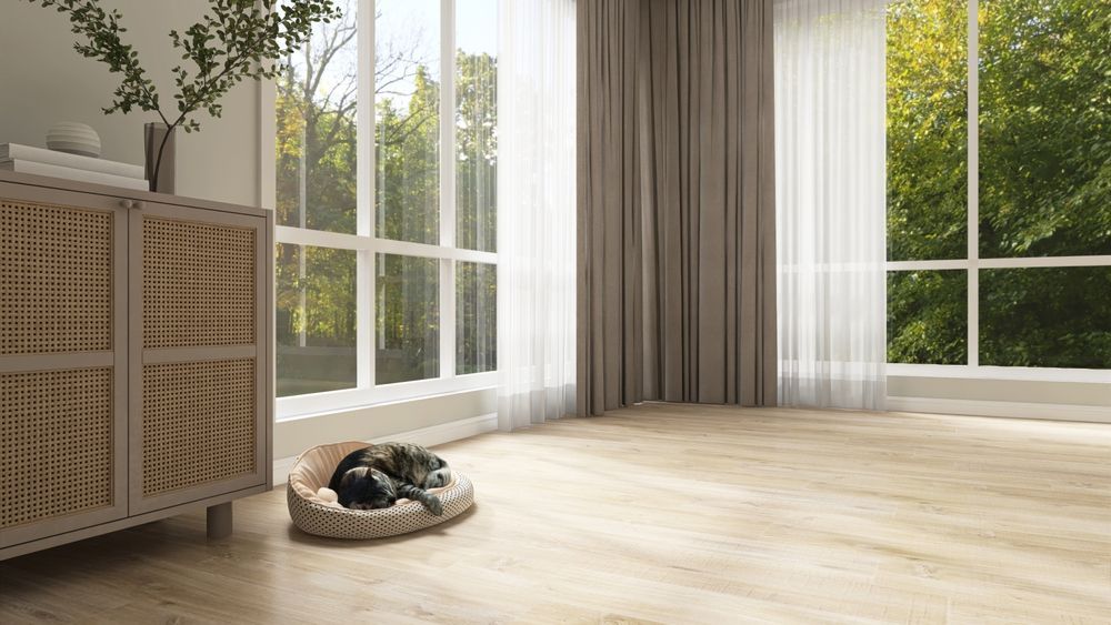 Gray Roman shade over a window against tan wall. The shade is partially folded up.