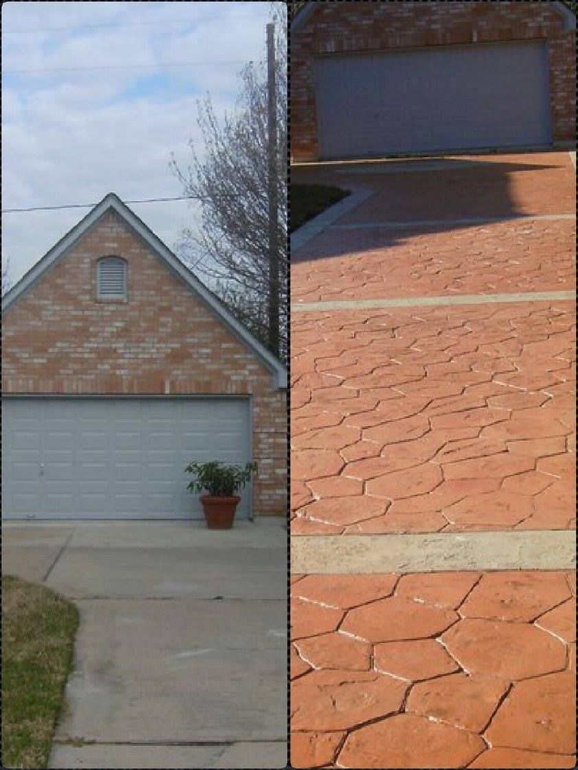 Brick garage with gray door, concrete driveway to the left, and stamped red concrete driveway to the right.