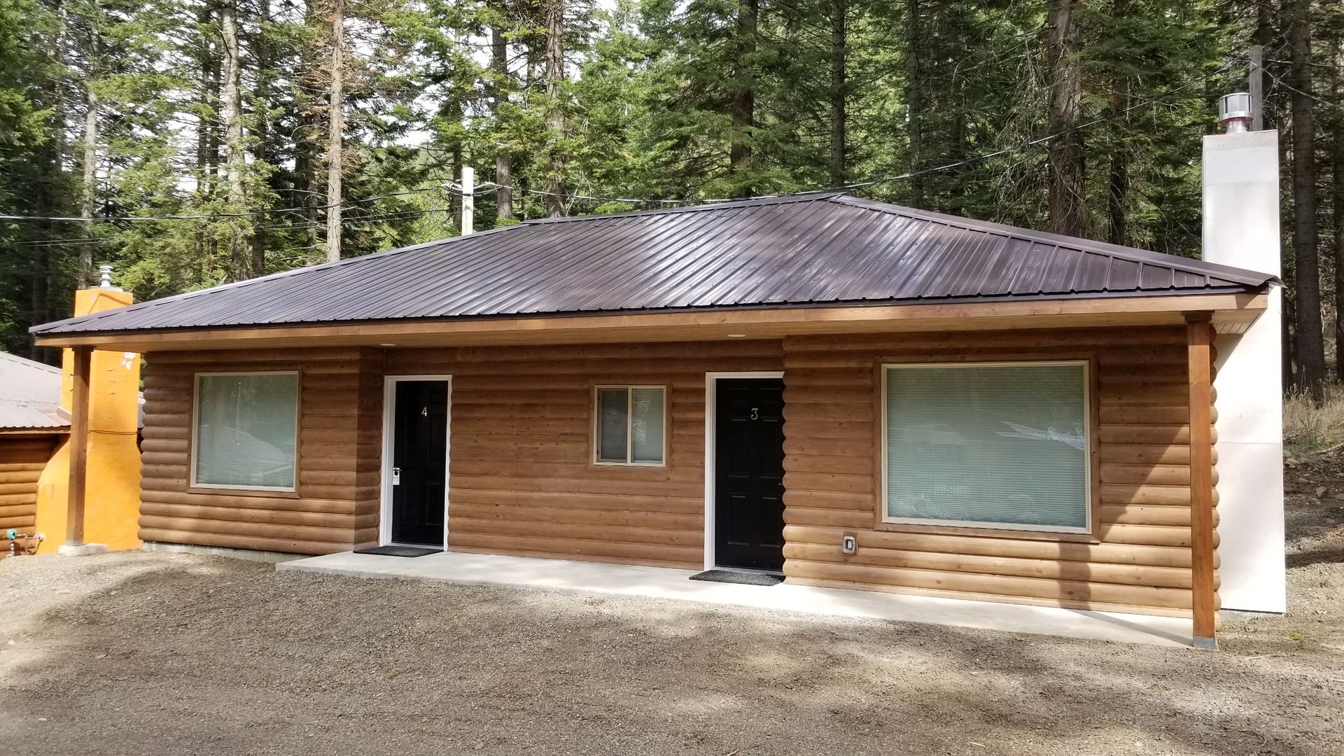 A log cabin in the middle of a forest