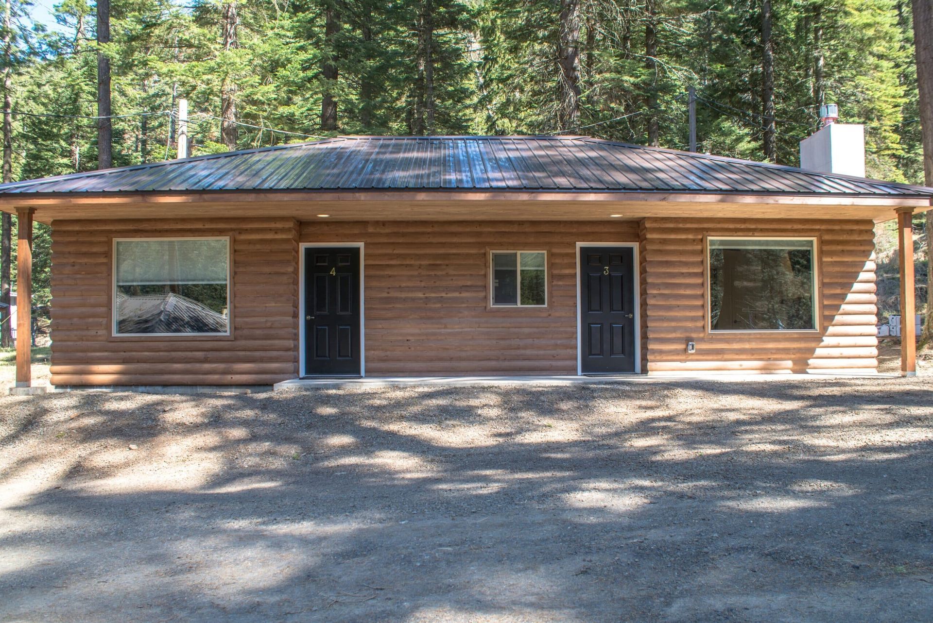 A wooden house in the middle of a forest