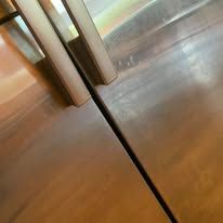 Close-up of stainless steel double doors with a narrow gap between them