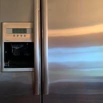 Stainless steel refrigerator with built-in water dispenser and control panel