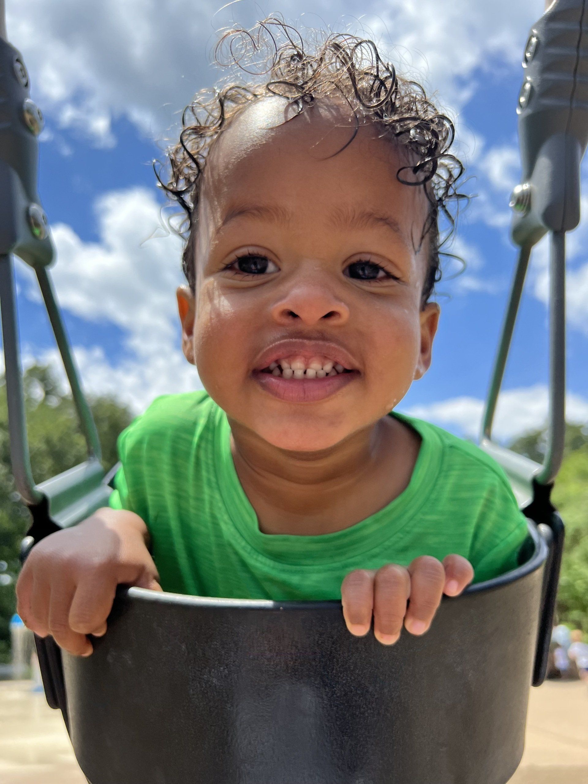 Cute Baby On Swing — Keswick, VA — Monticello Nannies