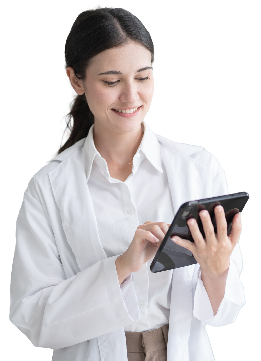 Woman in white lab coat smiles while using a tablet. Woman in white lab coat smiles while using a tablet.