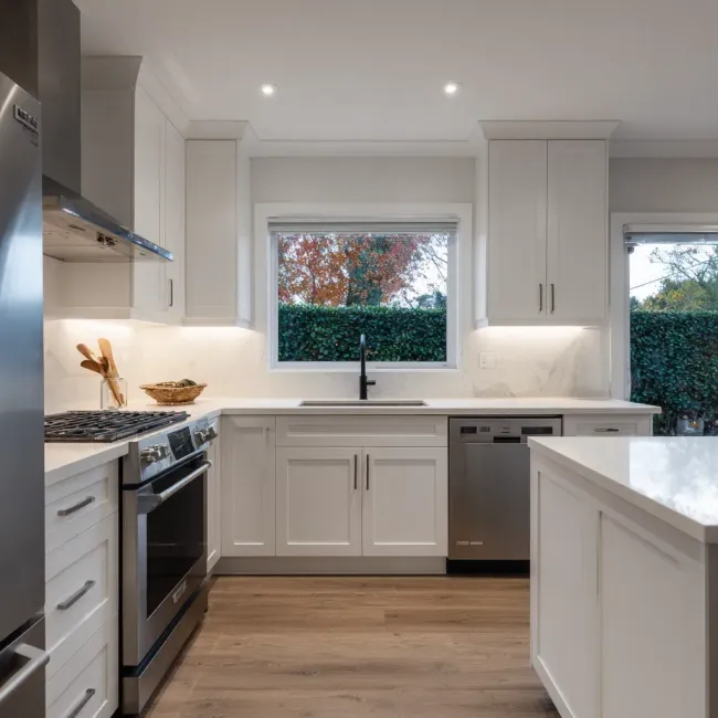 Open-concept kitchen remodeling Vancouver BC with layout expansion, structural beam installation, and quartz countertop integration.
Vancouver kitchen renovation transformation featuring cabinet refacing, granite island construction, and backsplash tile replacement.
Contemporary Vancouver kitchen remodel including quartz countertop upgrade, recessed lighting installation, and integrated cabinetry storage solutions.
Professional kitchen remodeling Vancouver BC with marble slab surfaces, tile flooring installation, and full-service renovation execution.