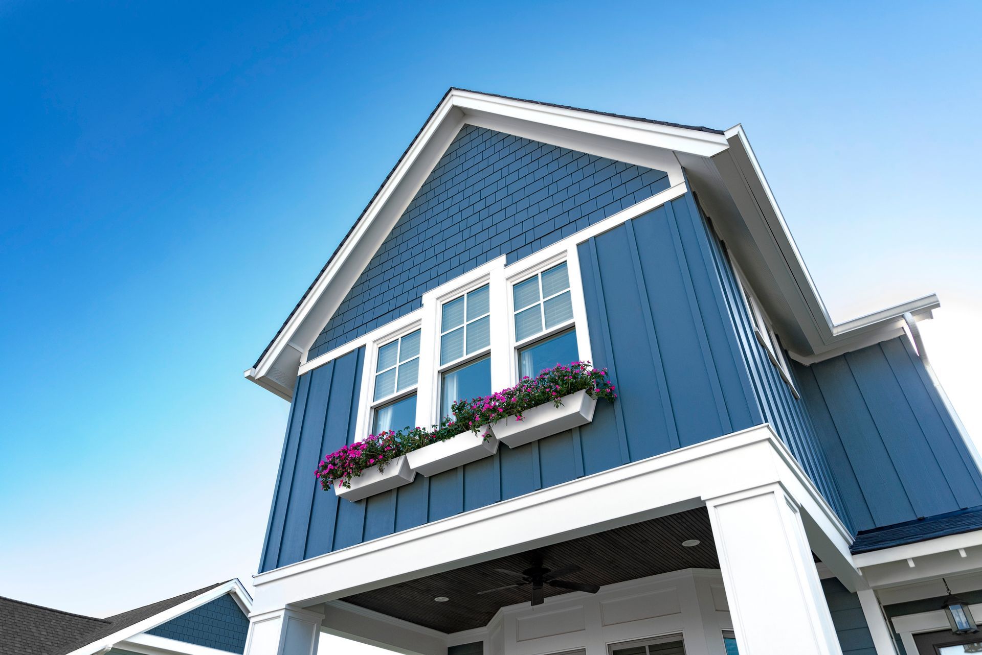 A house with a white gutter on the side of it