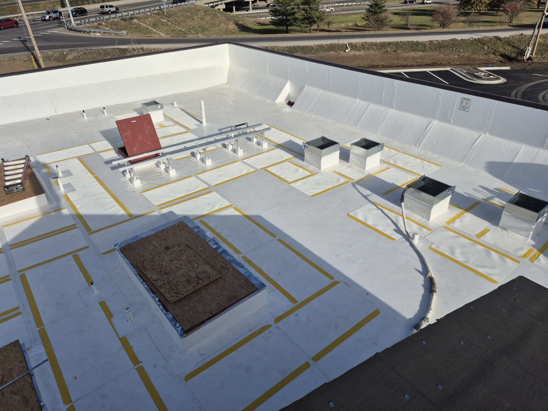 An aerial view of a house with a gray roof.