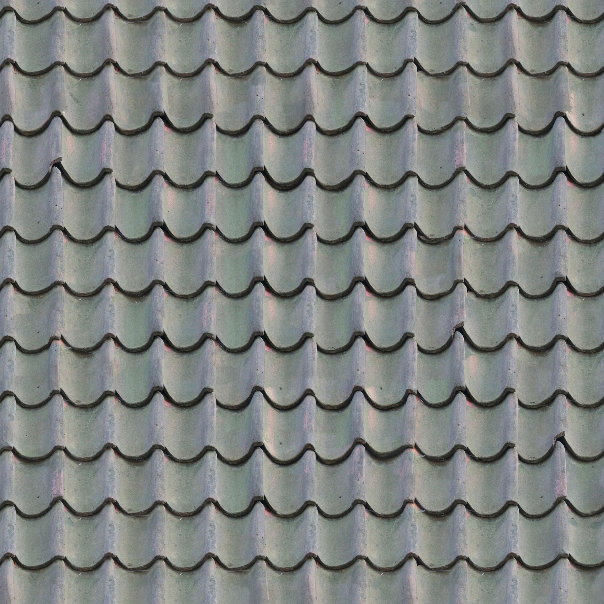 Gray tiled roof with wavy edges.