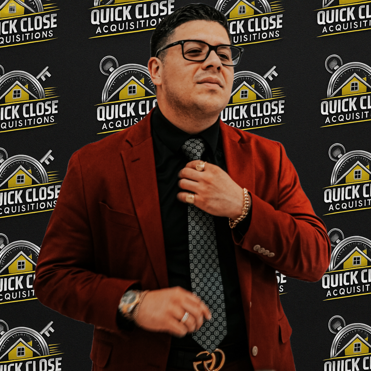 A man standing in front of a wall that says quick close