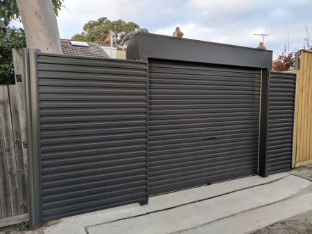 Gray Fence Line Garage Door — Sydney, NSW — Ryde Garage Doors