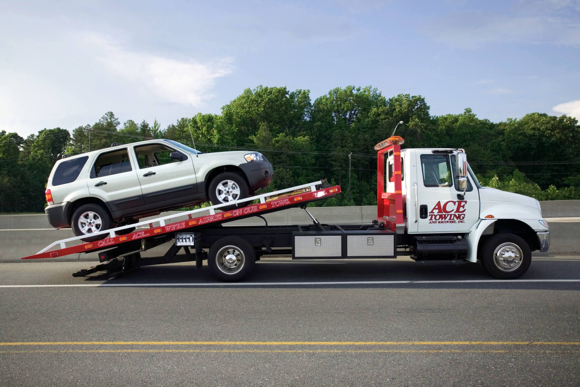 SUV on Tow Truck — Auto Electrical in Junction City, KS
