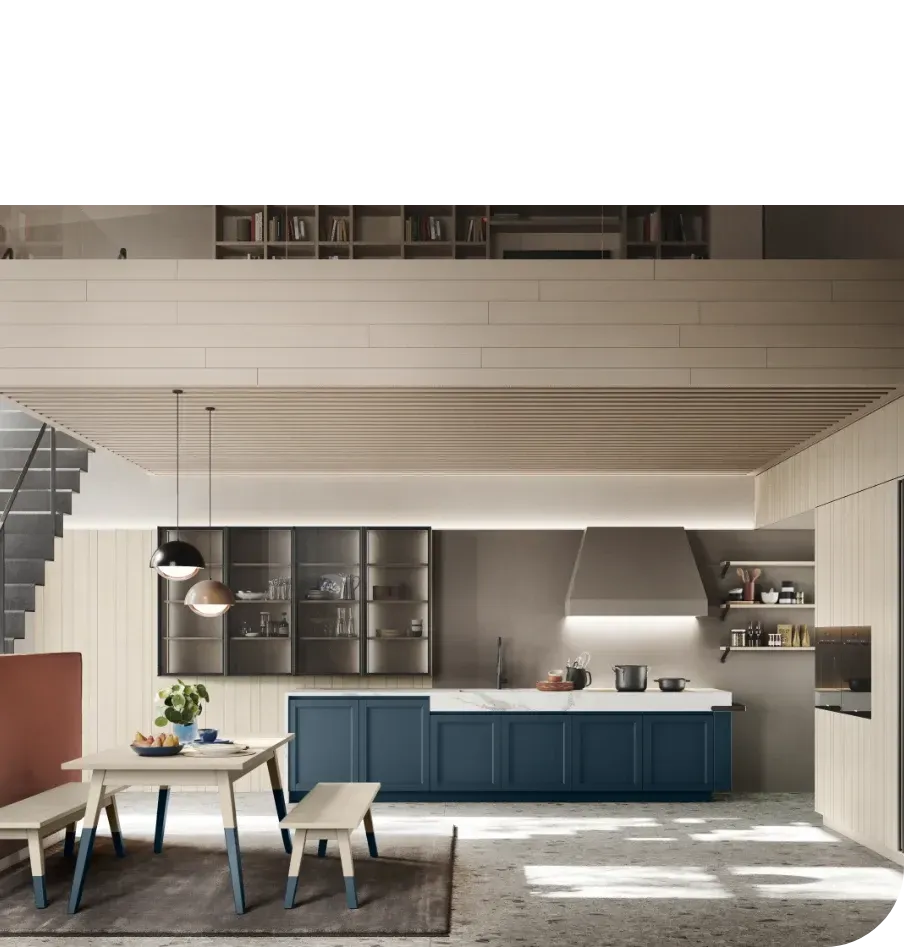 Una cucina con tavolo e sedie e un lavello.