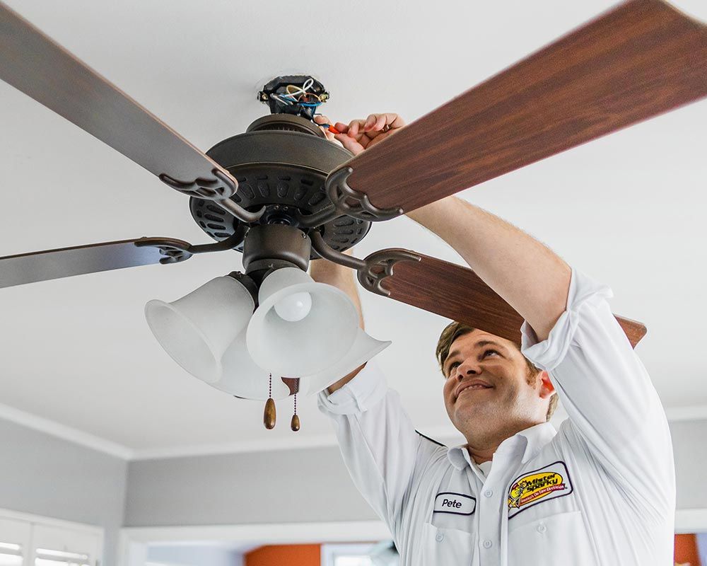 Mister Sparky technician installs a ceiling fan