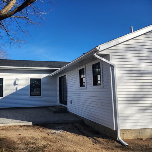 House With New White Gutters