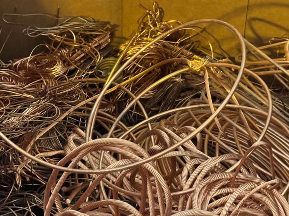 A pile of copper wire is sitting on a table.