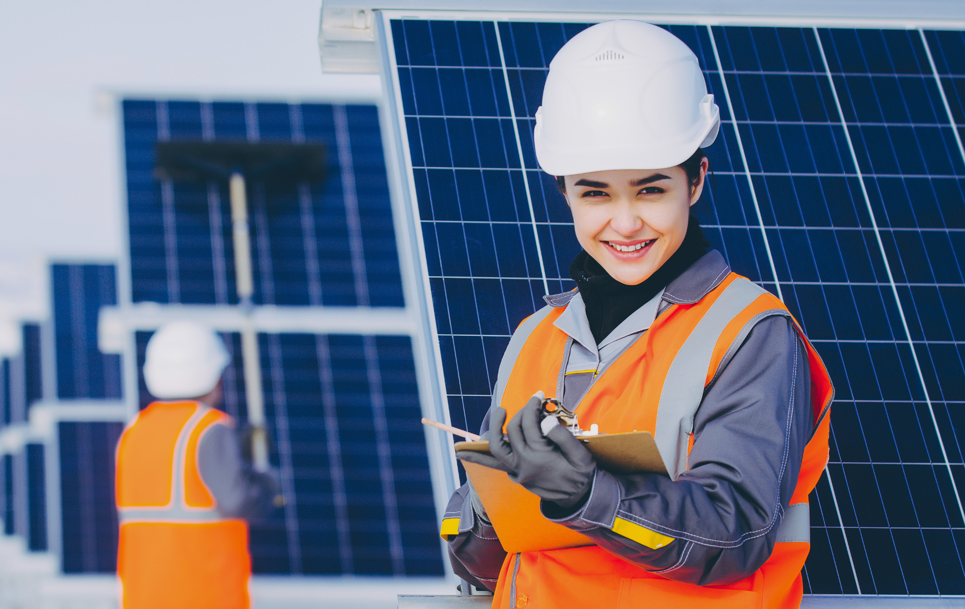 Solar panels on a rooftop, generating renewable energy under a bright blue sky.