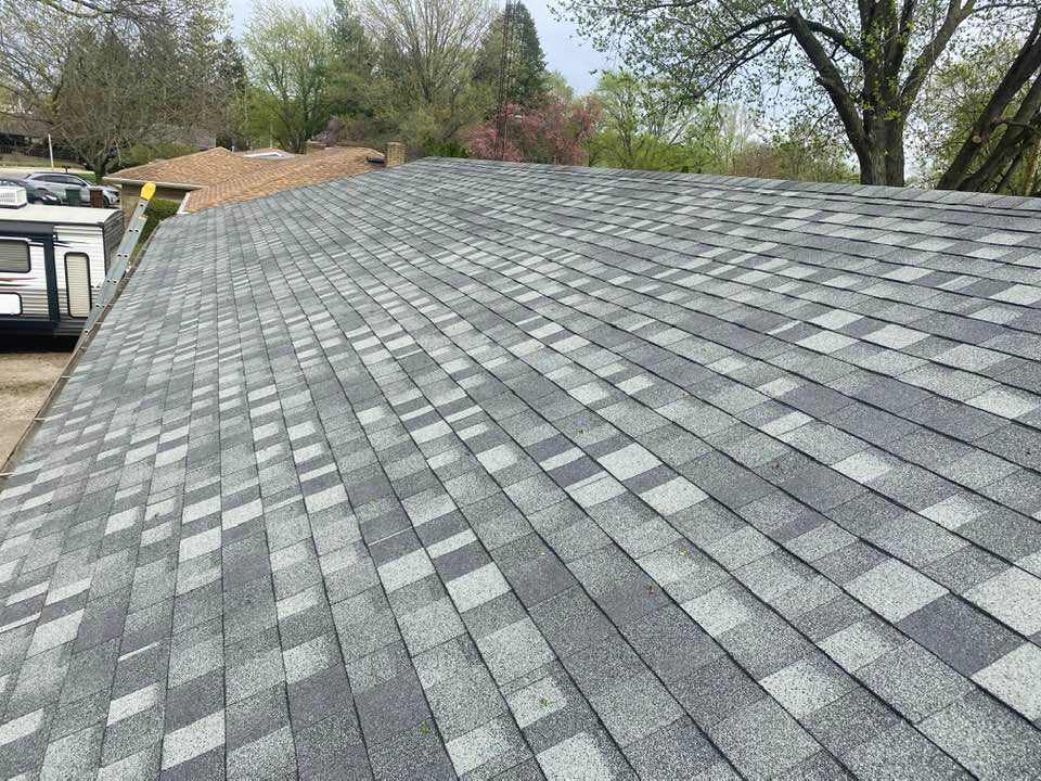 A close up of a roof with a lot of shingles on it.