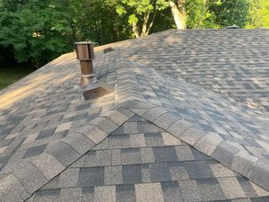 The corner of a house with a blue sky in the background