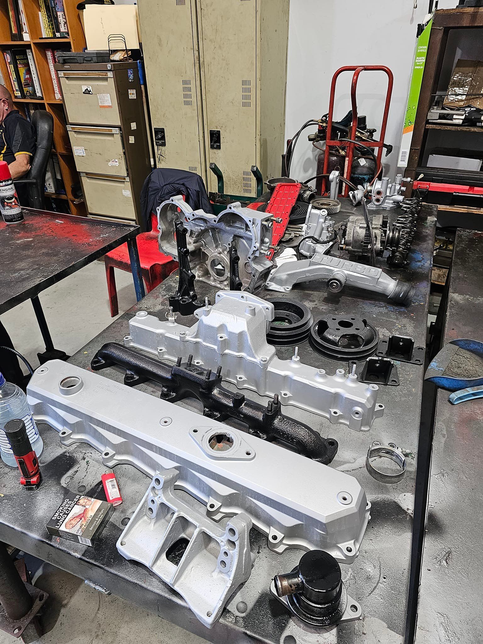 Engine Parts Laid Out on a Workbench in a Workshop — Diesel Engine Rebuilding Australia in Gold Coast, QLD