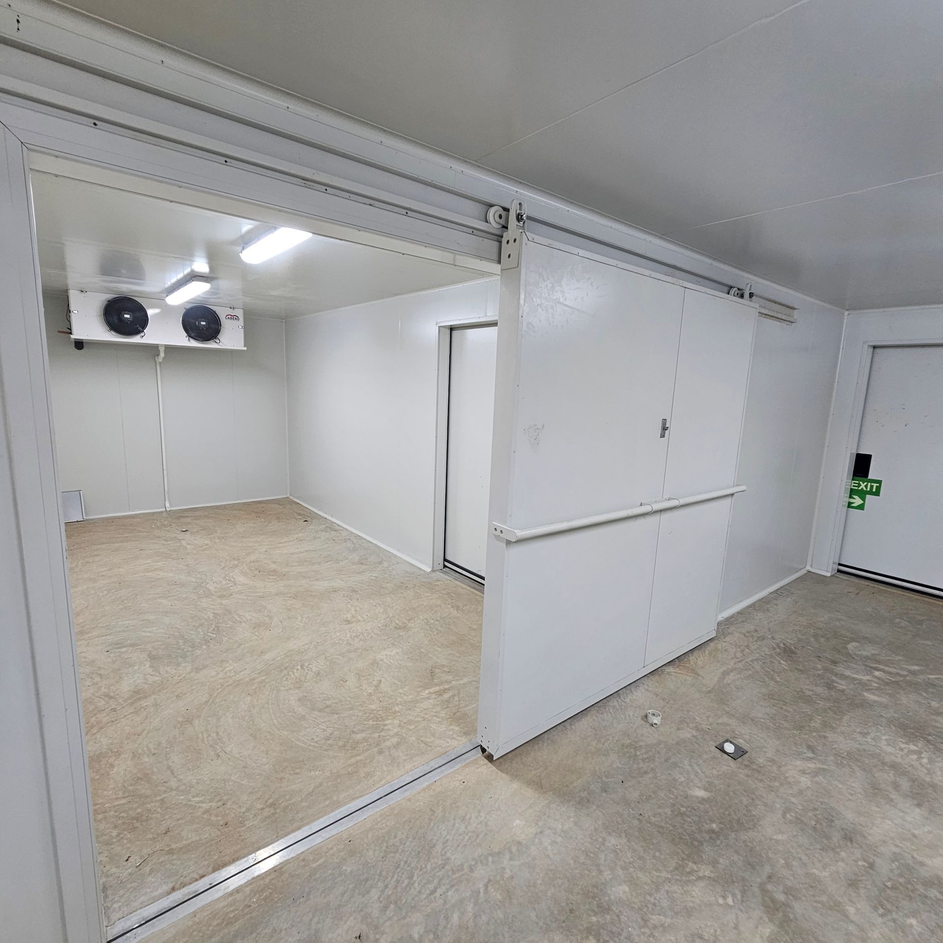 A Room With White Walls and a Sliding Door — Refrigeration & Air Conditioning in Katherine East, NT