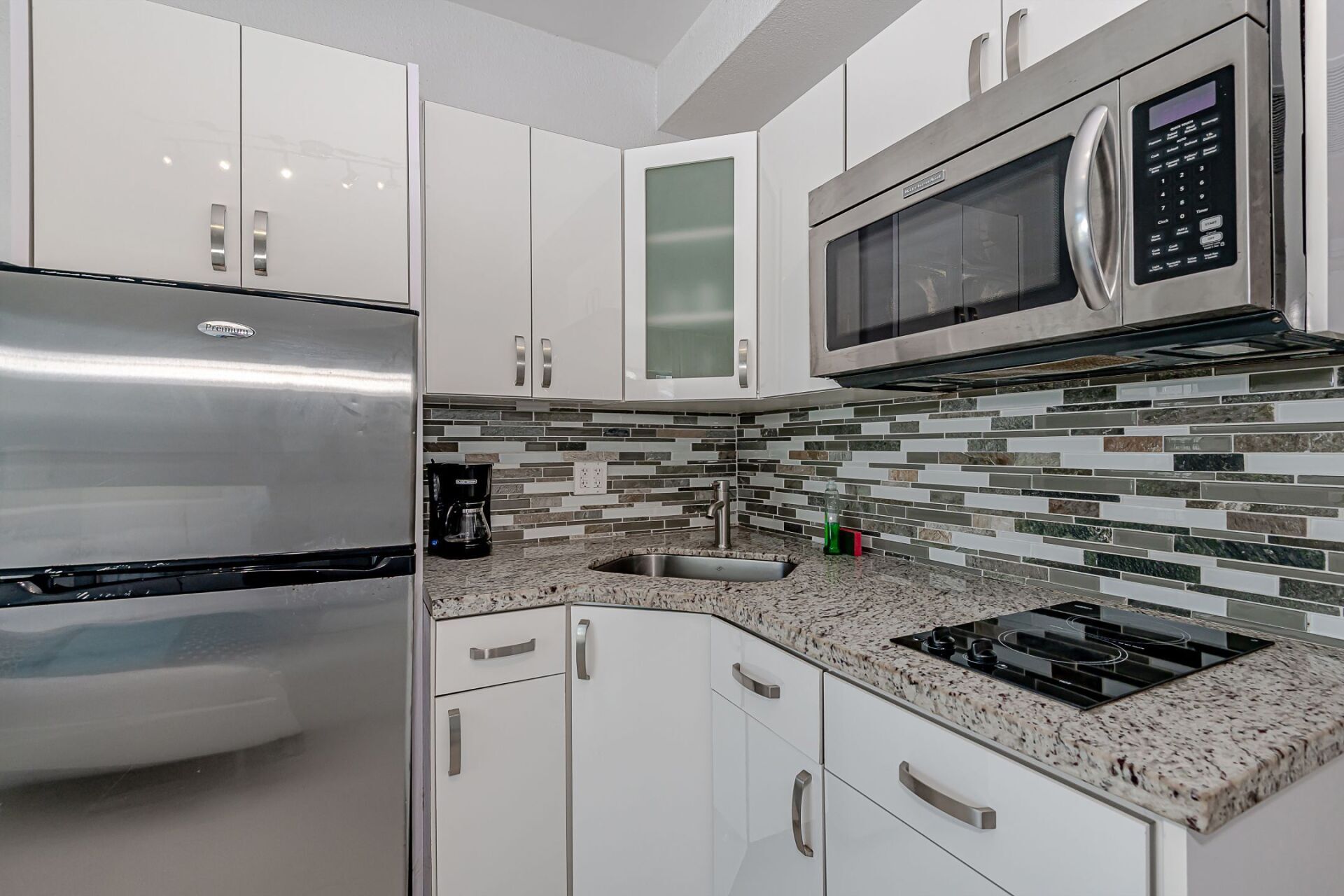 A kitchen with stainless steel appliances and granite counter tops