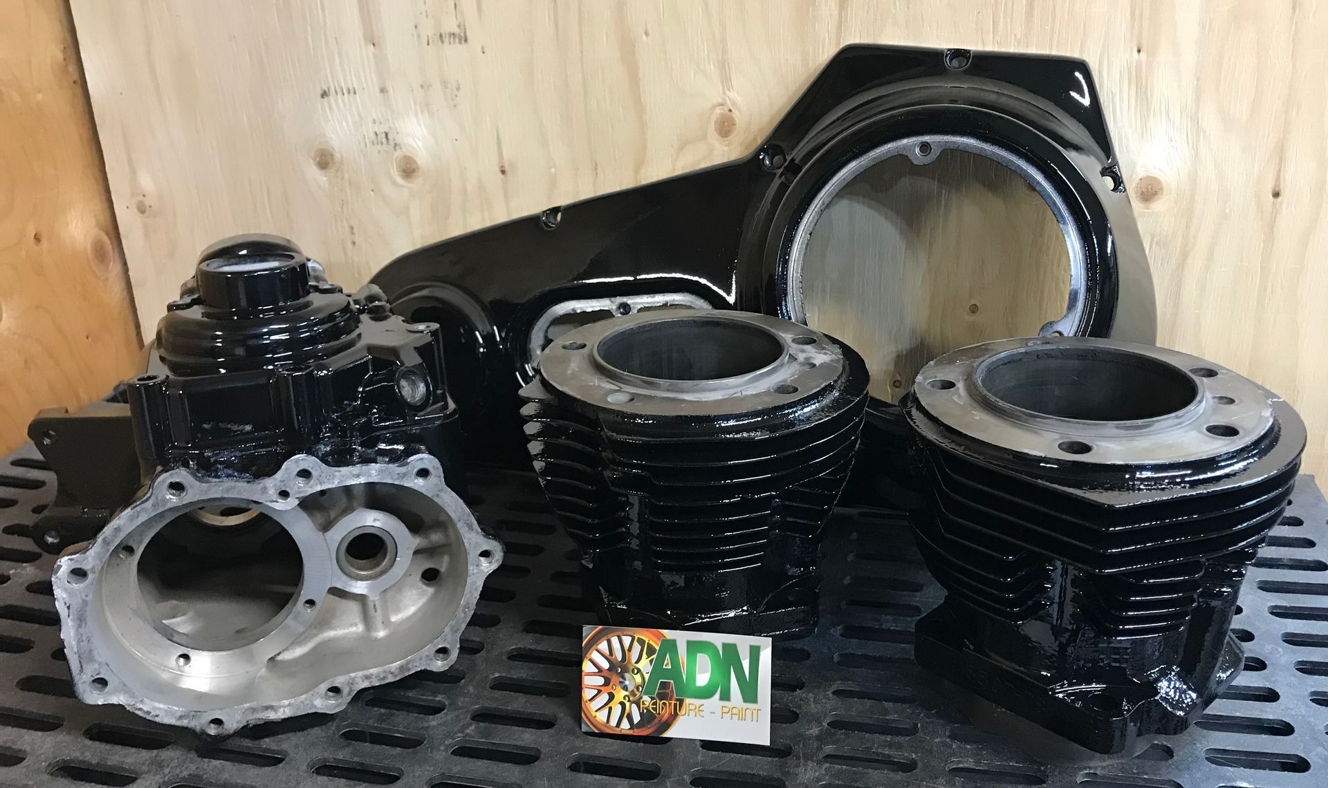 A bunch of motorcycle parts are sitting on a table.