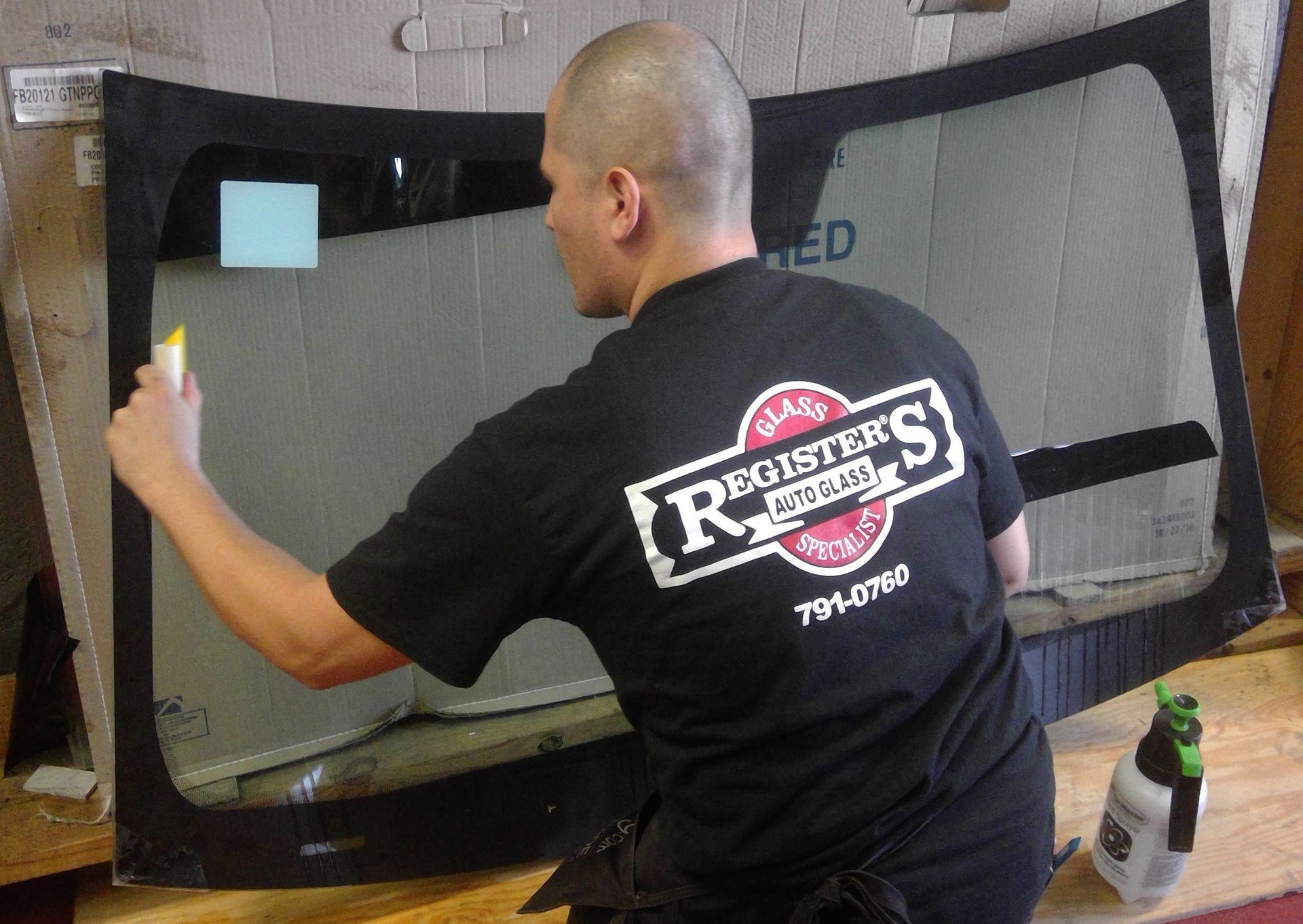 A man wearing a black shirt that says registers on it