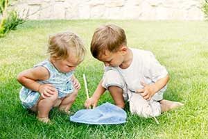 kids playing on a pest controlled lawn in College Station, TX