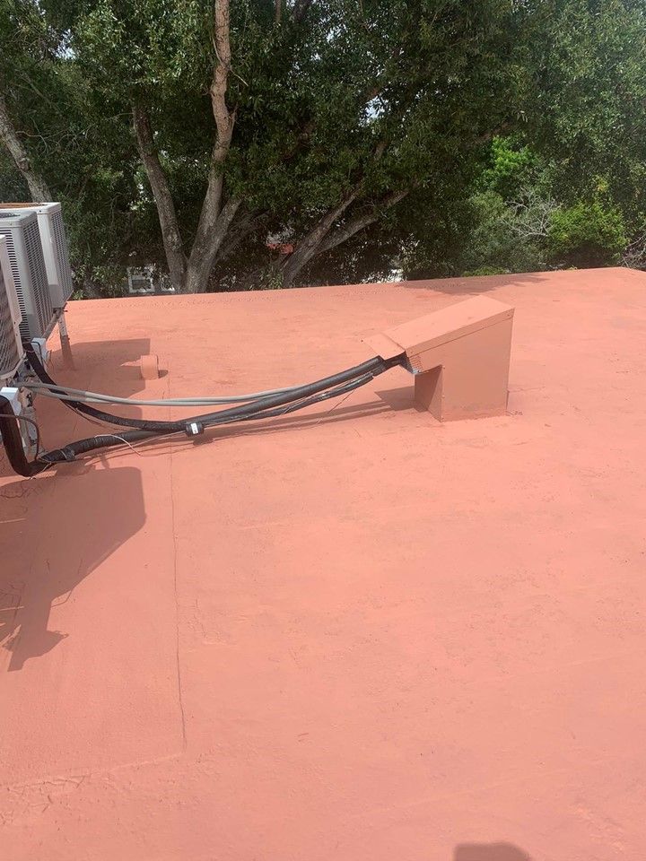 A roof with a bunch of wires on it and trees in the background — Tampa, FL — Bill Shields Roofing