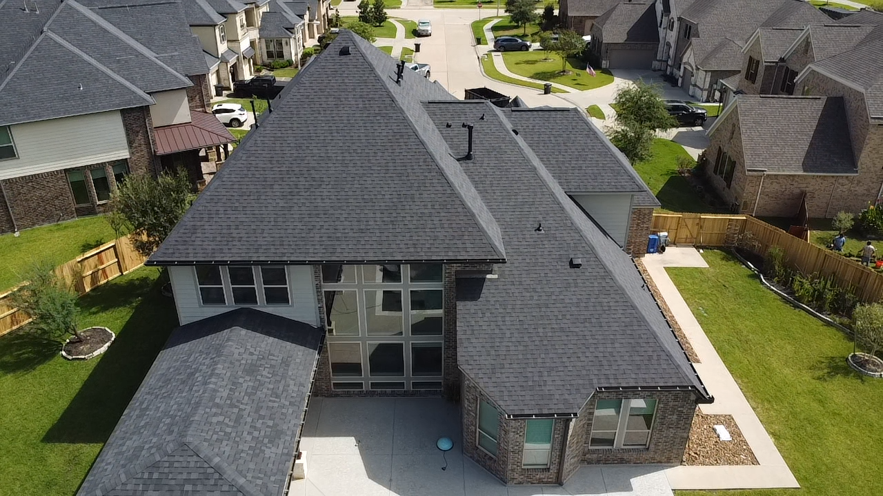 An aerial view of a house in a residential area